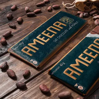 Ameena product design by art zoom studio, package design, chocolate, cocoa, green, gold, brown colour, chocolate on table, product photography