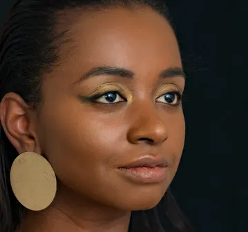 Portrait, art zoom studio photography, black woman, ebony, face, gold